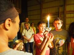 Retreat kids holding a havdalah candle